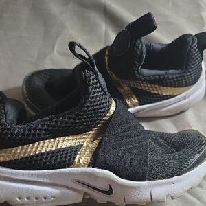 Nike Kids Black Sneakers with Gold Accents